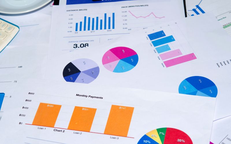 Lots of different charts printed out on paper on a desk